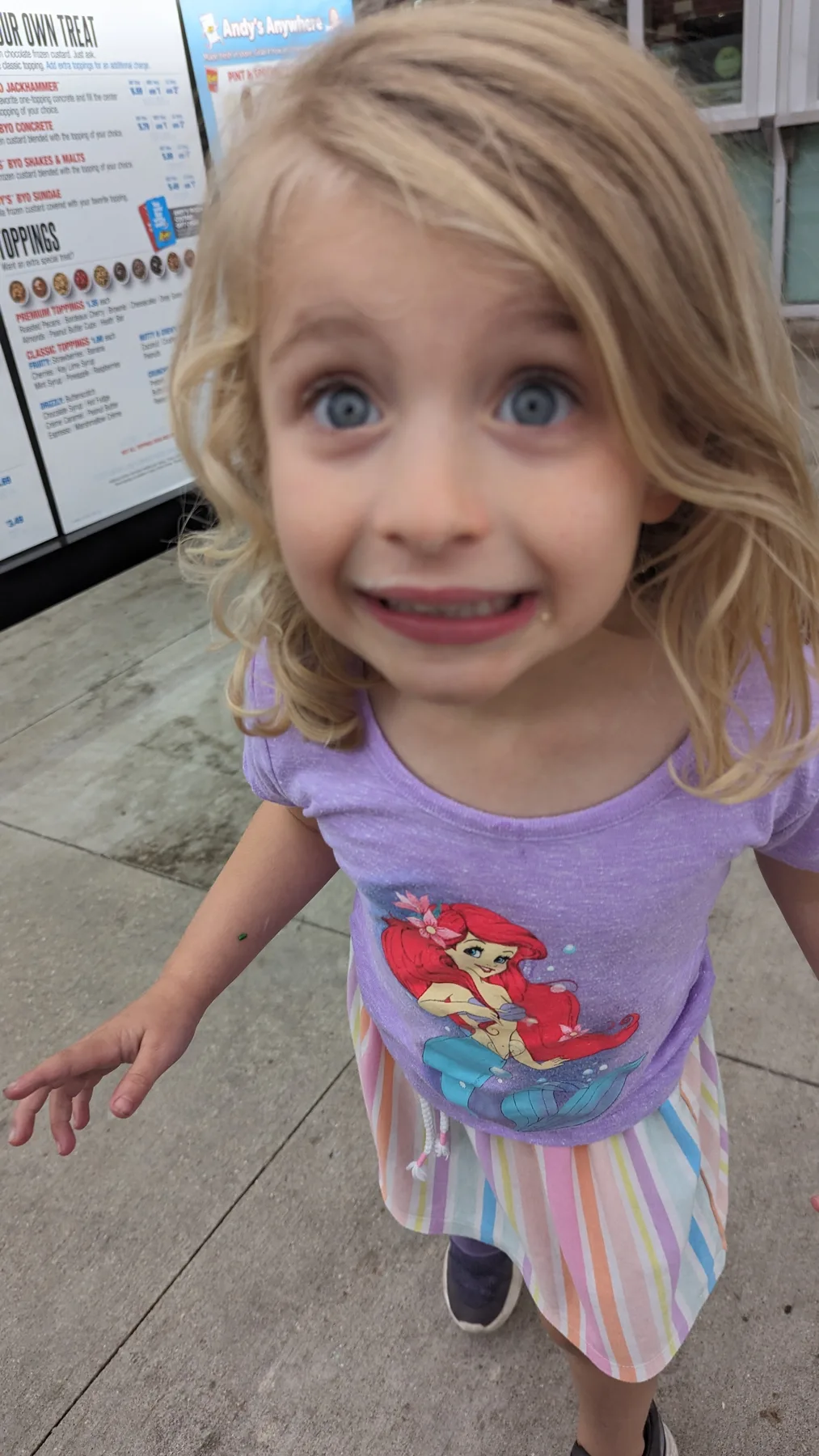 Abigail grinning at the camera