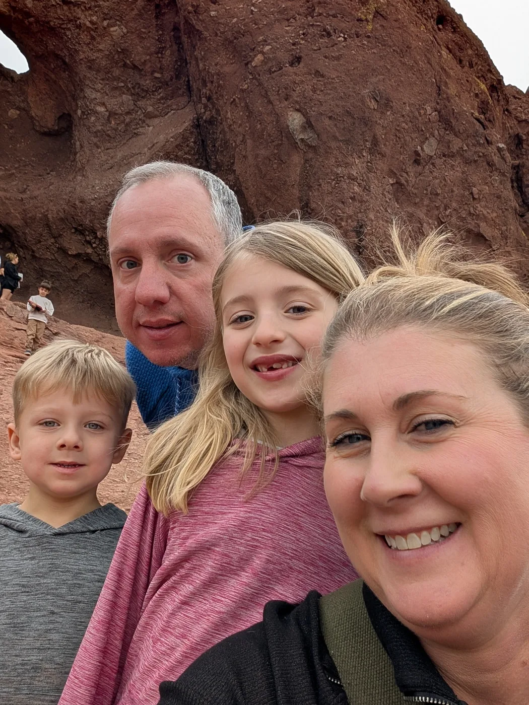 Family selfie in front of red rock formations